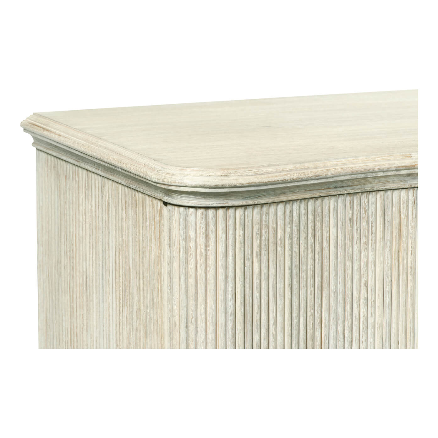 Close-up of reeded cabinet top, detailed corner view.