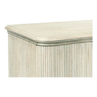 Close-up of reeded cabinet top, detailed corner view.