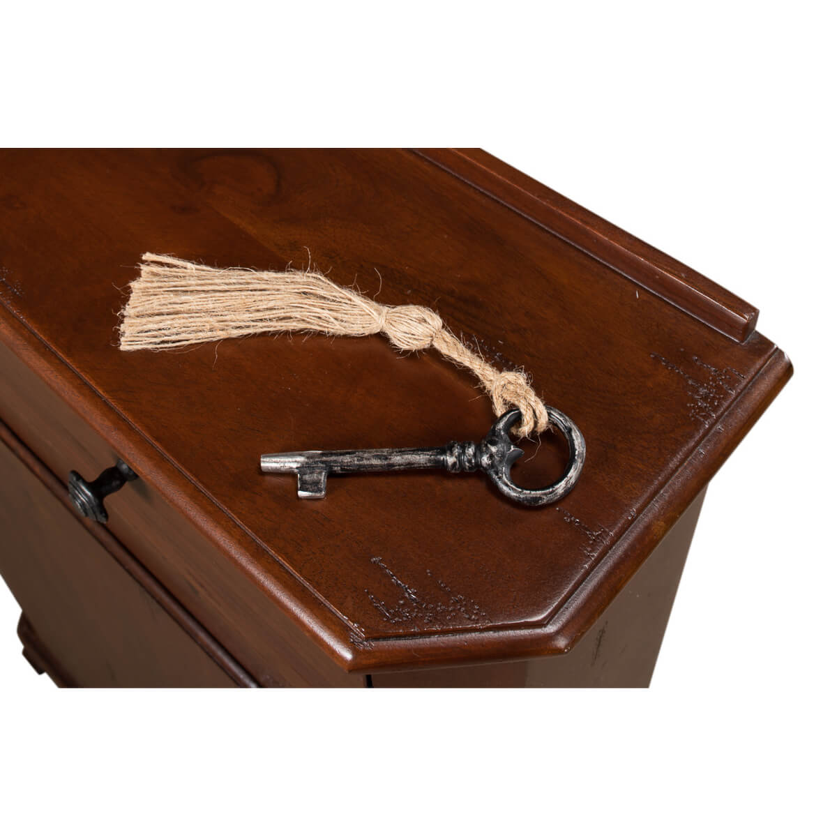 Close-up of vintage key on top of side cabinet.