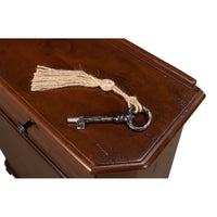 Close-up of vintage key on top of side cabinet.