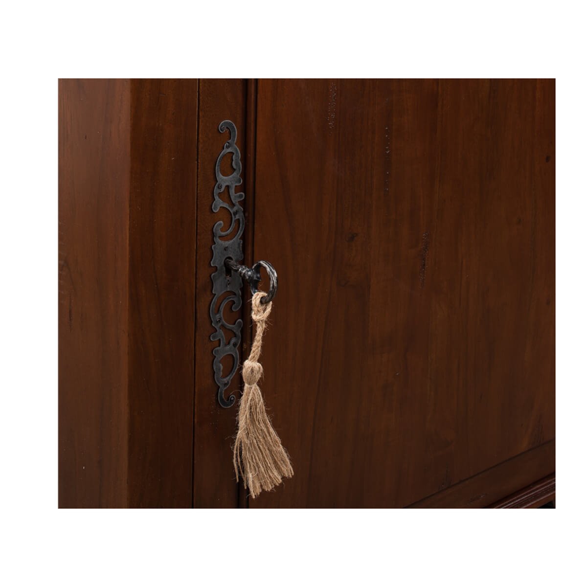 Close-up of cabinet handle with tassel key.