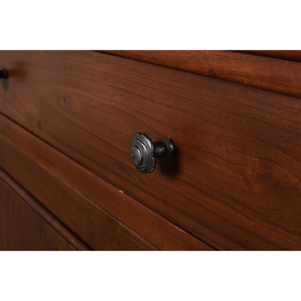 Detail of drawer knob on walnut side cabinet.