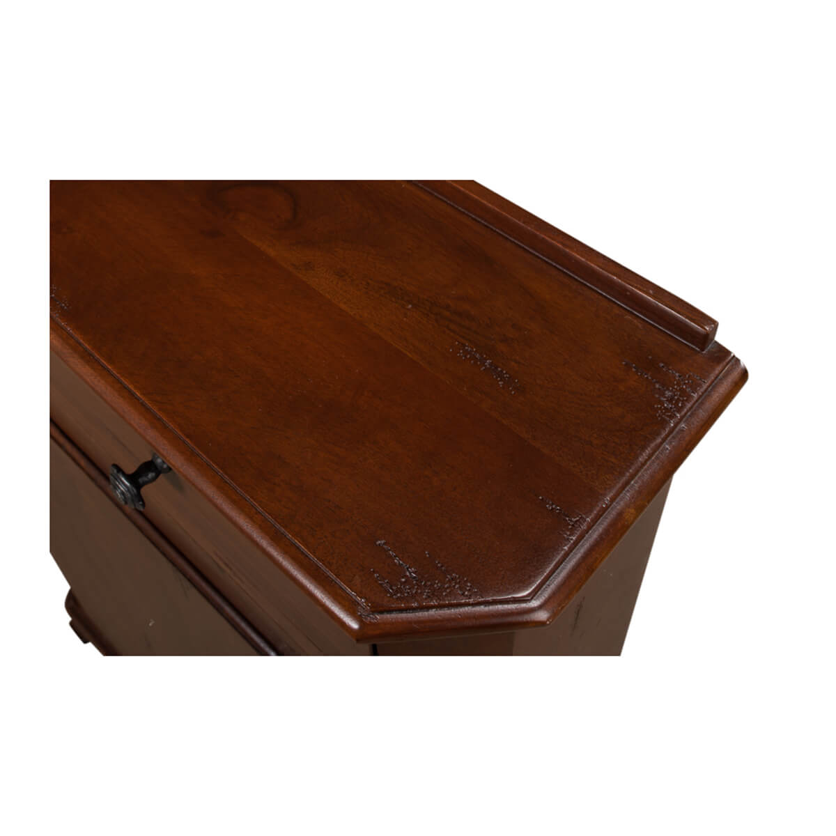 Close-up of wood texture on cabinet top surface.