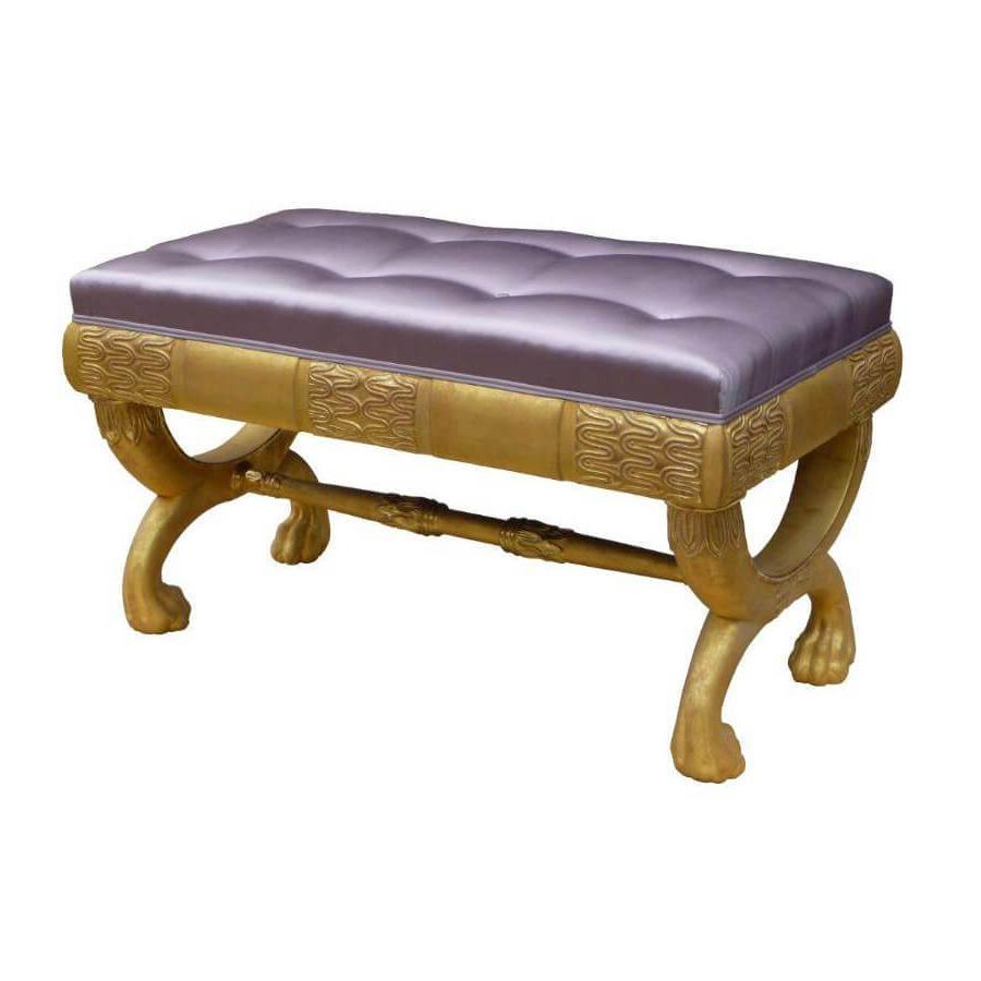 Regency bench with purple cushion and ornate wood legs.