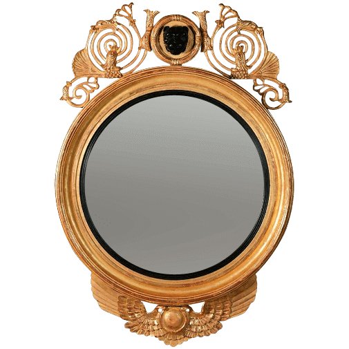 Ornate Regency convex mirror with intricate leopard mask.