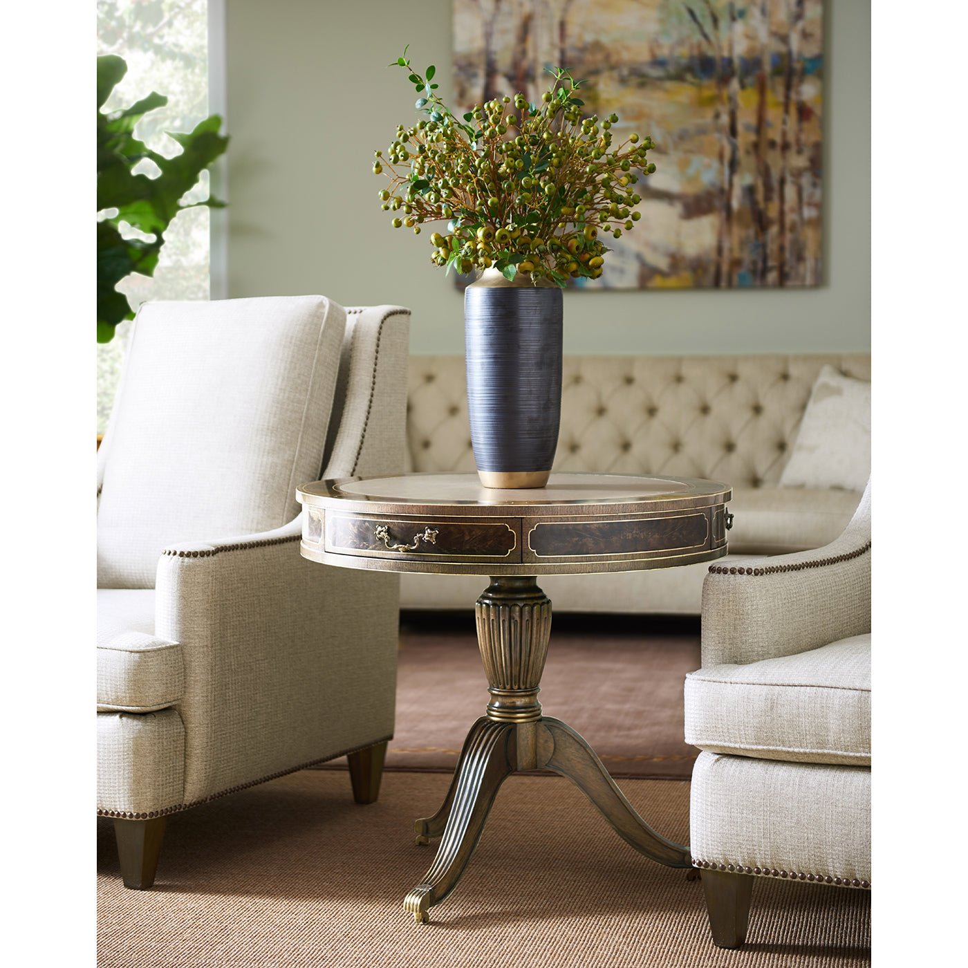 Regency drum end table in living room setting.