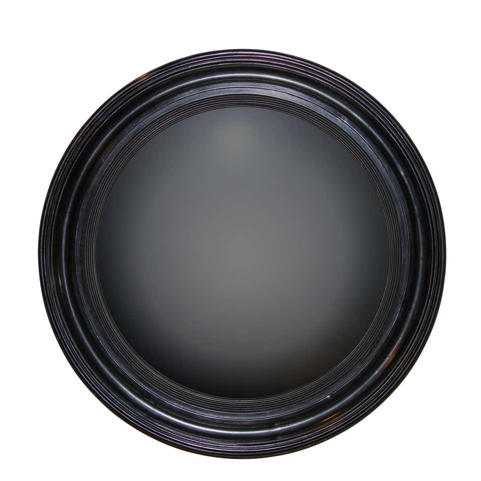 Dark Regency ebonized convex mirror with reflective surface.