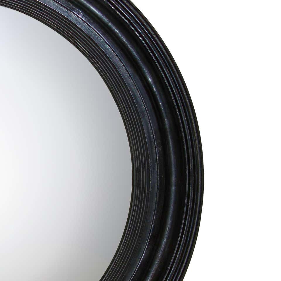 Detailed right side view of Regency ebonized mirror frame.