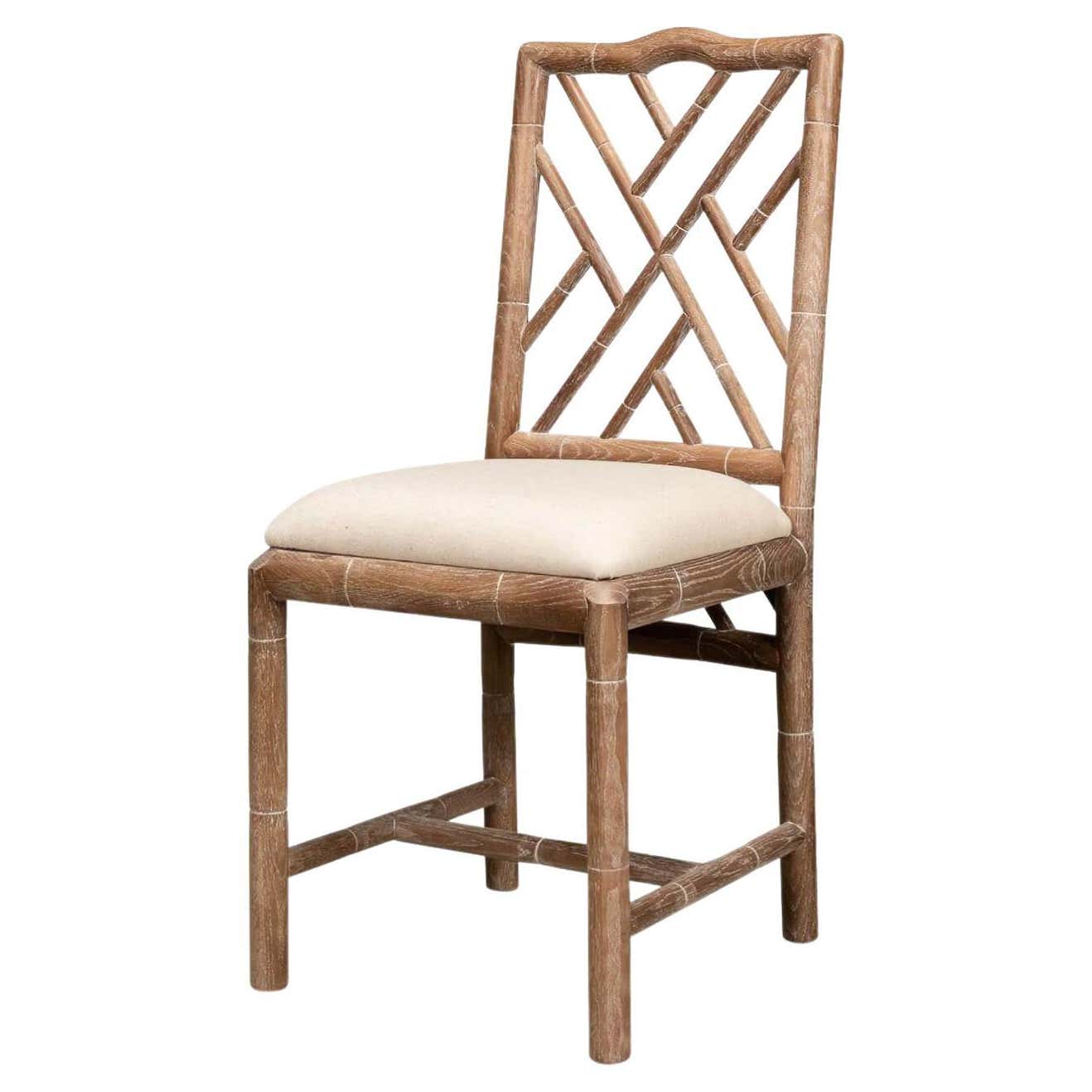 Side chair, angled view, faux bamboo design, beige cushion.