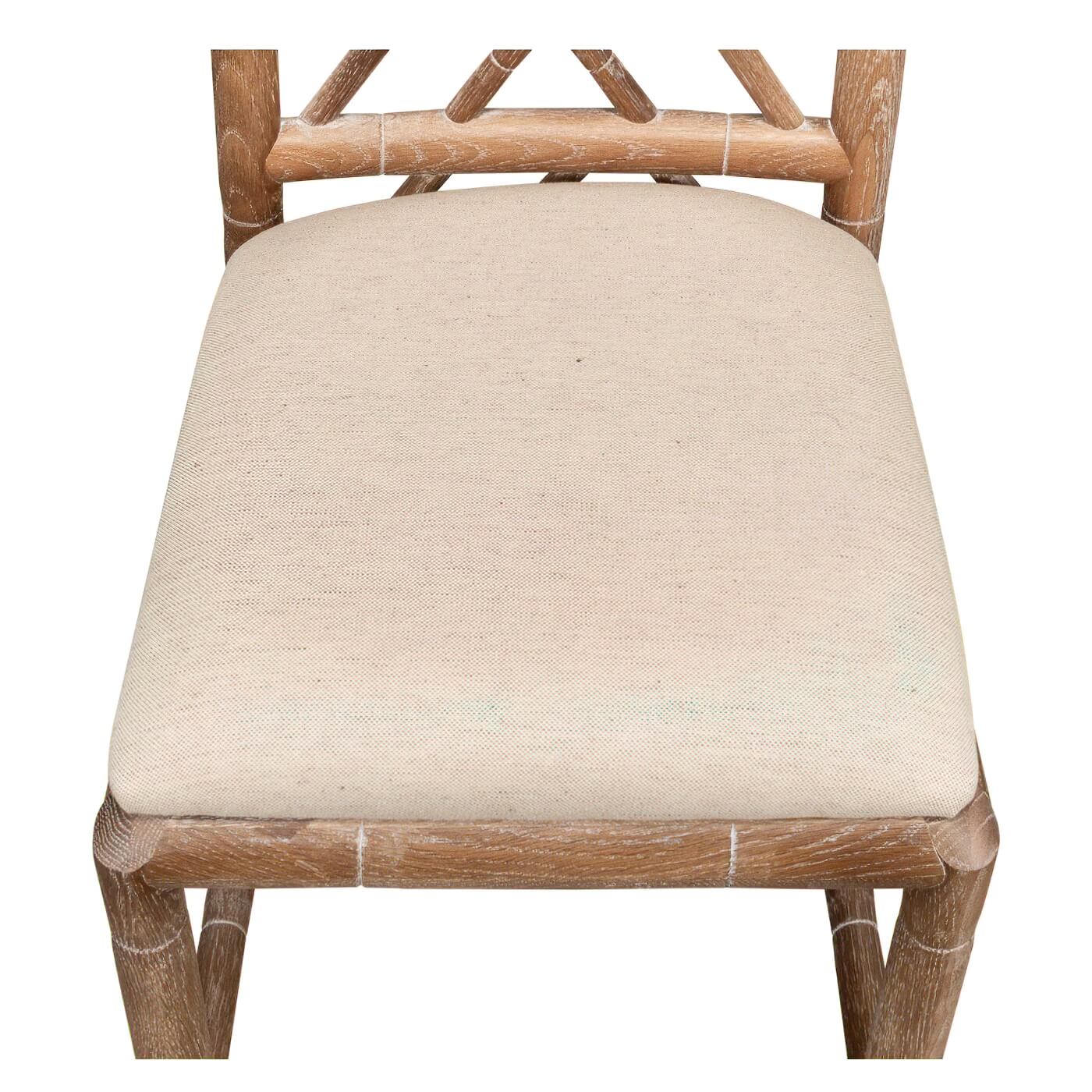 Top view of seat, beige cushion, faux bamboo chair.