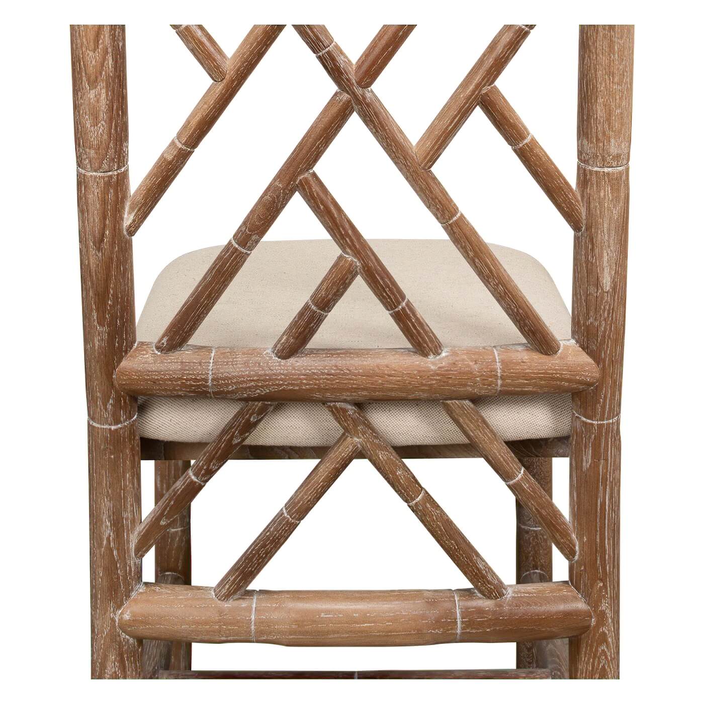 Close-up of chair back, faux bamboo, geometric detail.