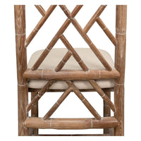 Close-up of chair back, faux bamboo, geometric detail.