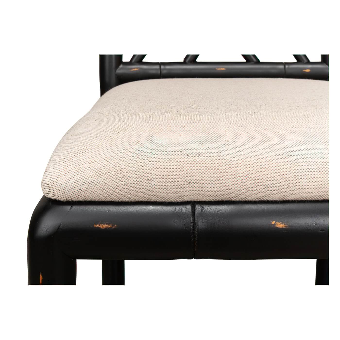 Close-up of beige chair cushion and frame.