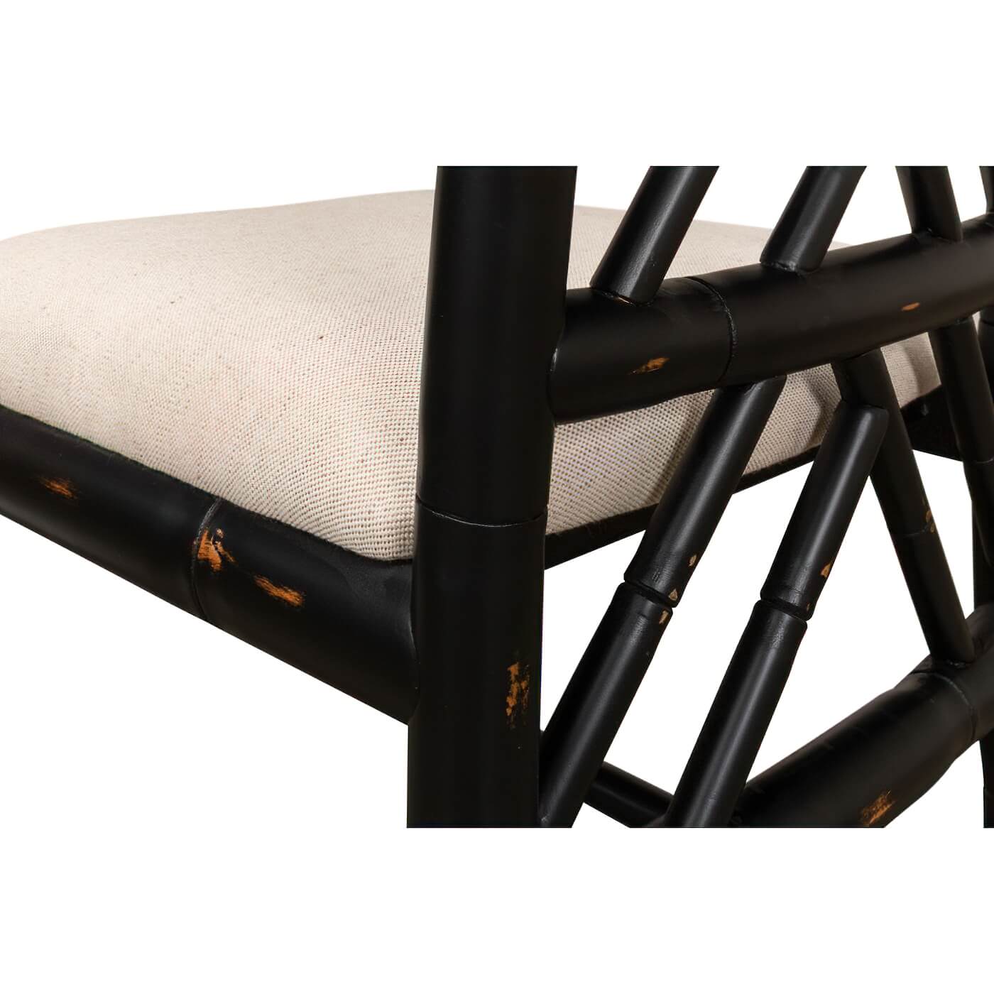 Close-up of black faux bamboo chair seat detail.
