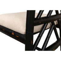 Close-up of black faux bamboo chair seat detail.