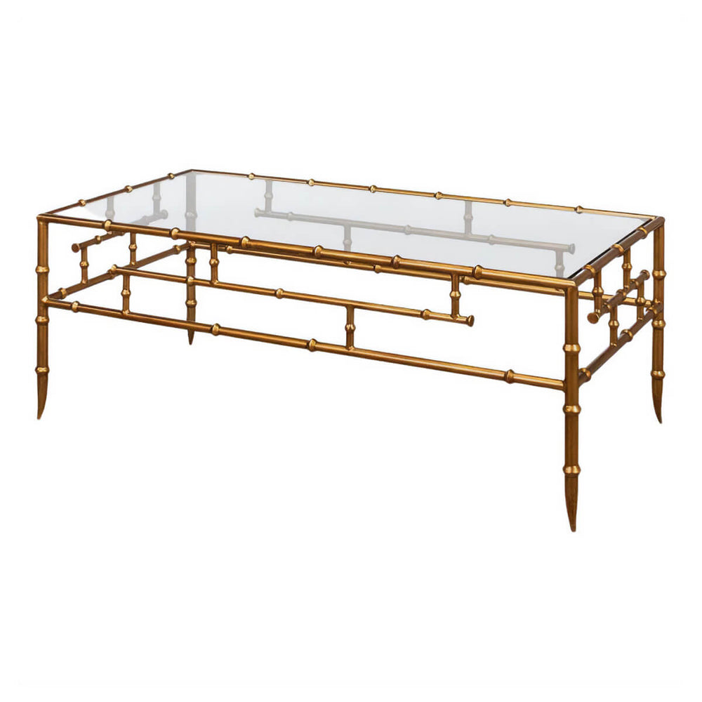 Glass top gilt bamboo coffee table, angled view.