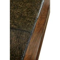 Close-up of desk's leather top, detailed edge.