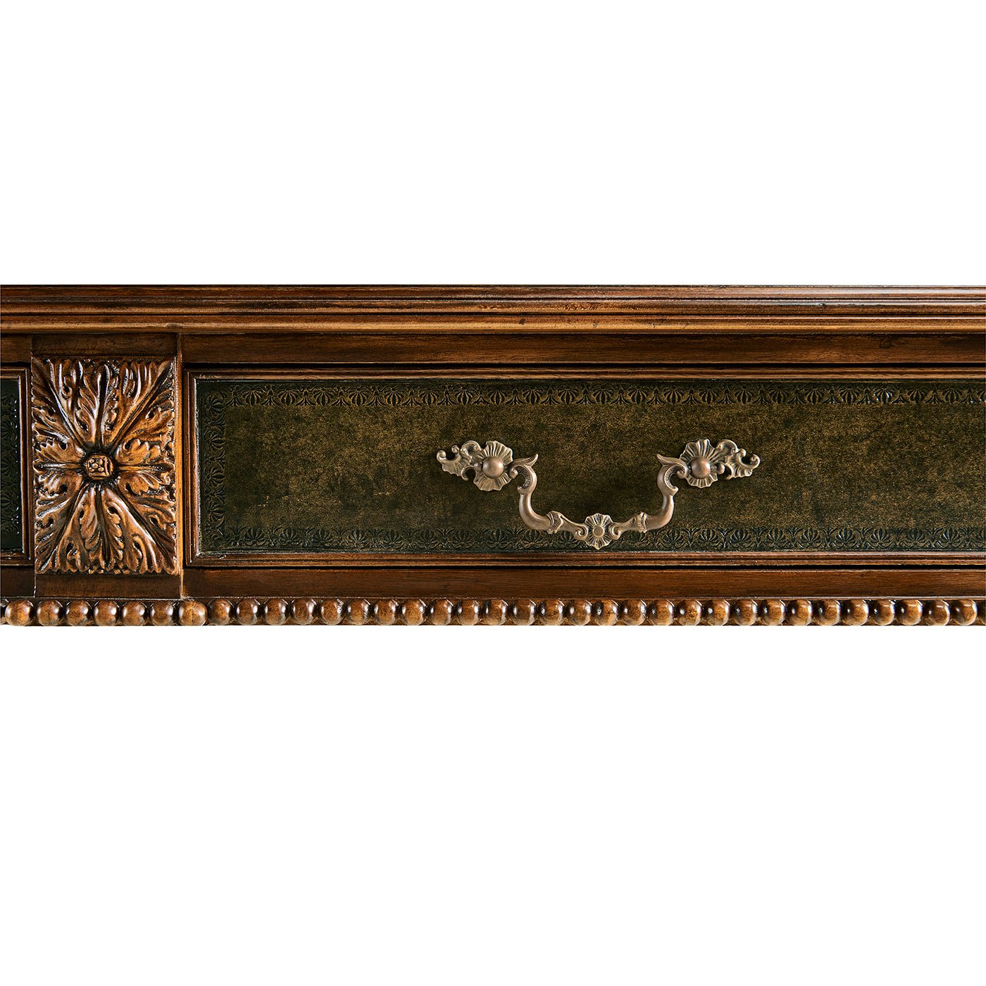 Detailed view of Regency desk's ornate handle design.