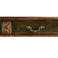 Detailed view of Regency desk's ornate handle design.