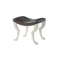 Stool with dark seat and white paw legs.