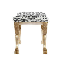Top view of stool with patterned seat and gold legs.