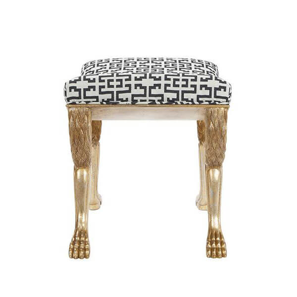 Top view of stool with patterned seat and gold legs.
