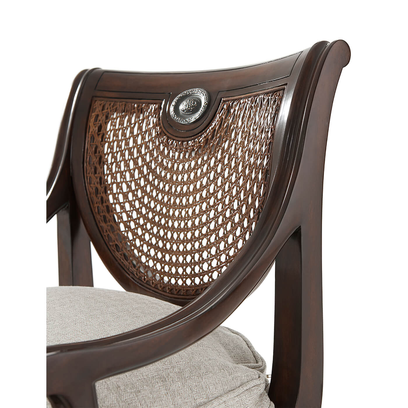 Close-up of Regency armchair woven back and cushion.