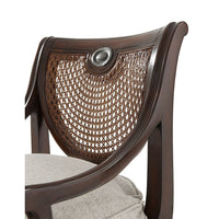 Close-up of Regency armchair woven back and cushion.