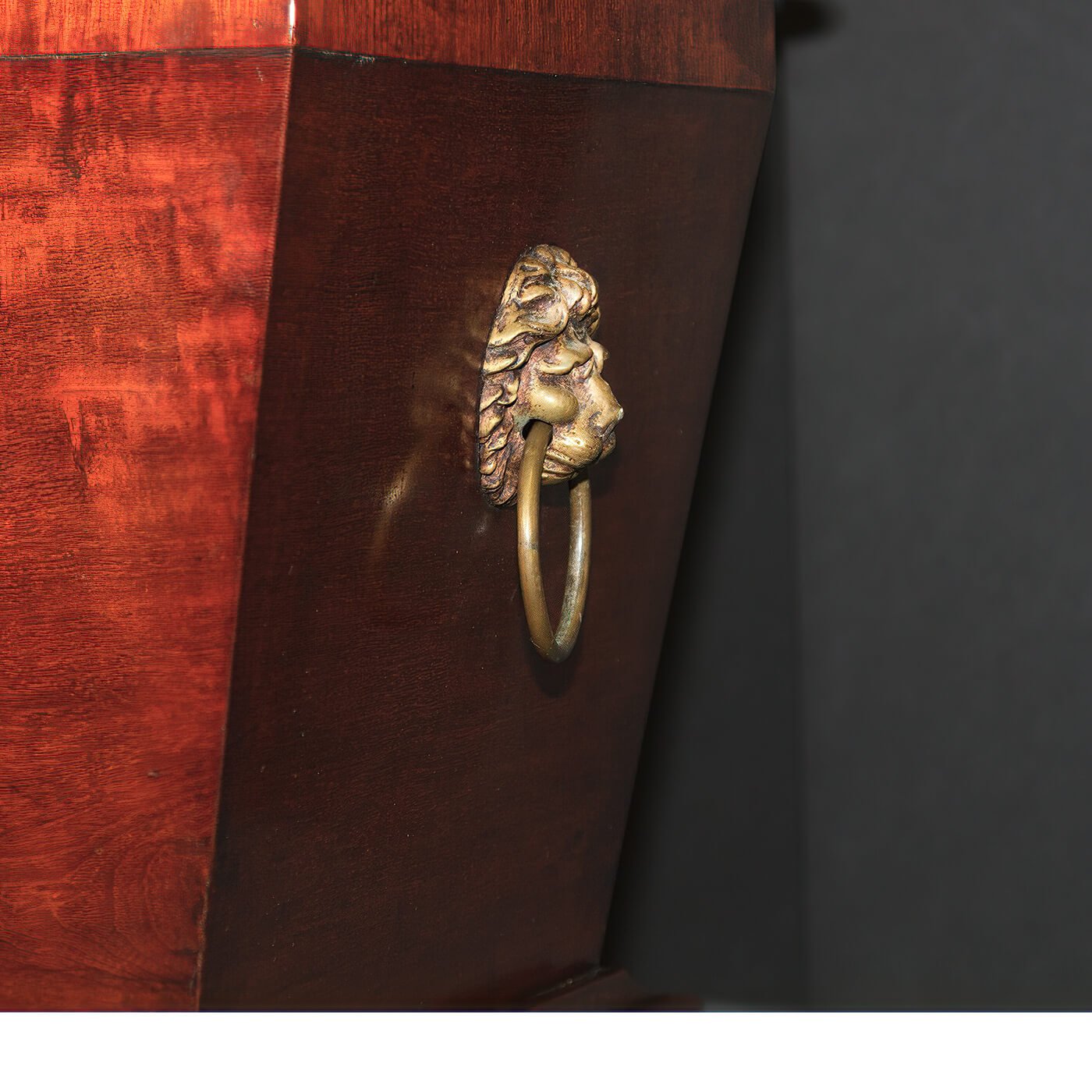 Regency mahogany cellarette, close-up of lion handle.