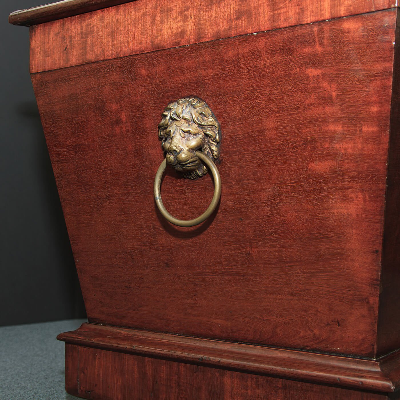 Regency mahogany cellarette, lion handle detail.