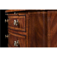 Close-up of drawer handles on Regency mahogany chest.