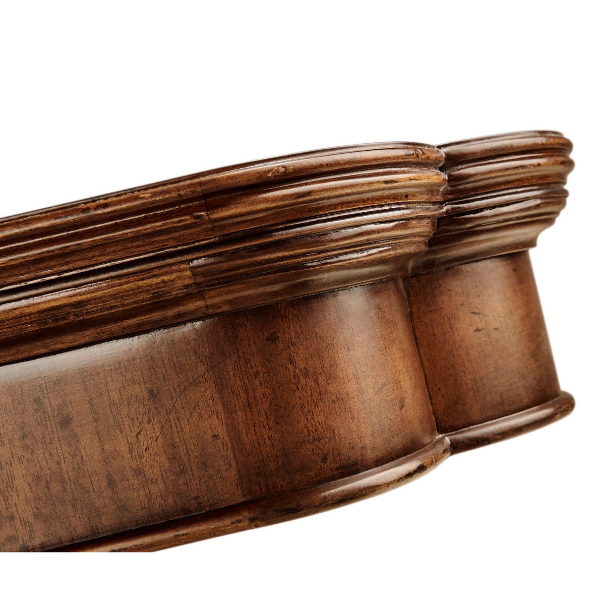 Pedestal detail of mahogany dining table, carved design.