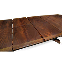 Mahogany dining table extension leaves, wood grain visible.