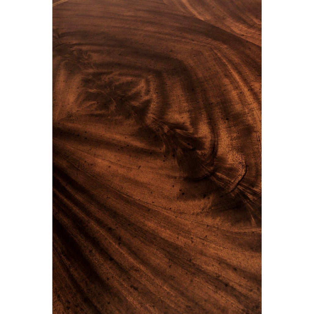Close-up of wood grain pattern on dining table.