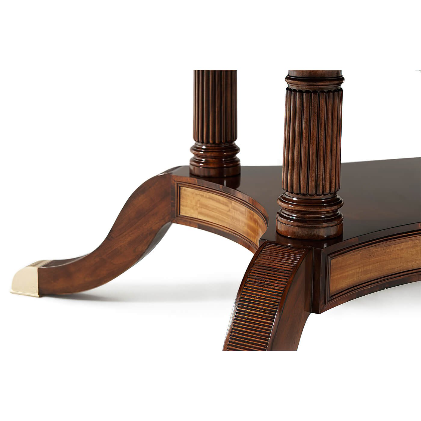 Detailed leg design of mahogany extension dining table.