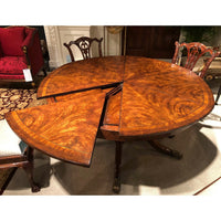 Dining table showing partially extended leaf.
