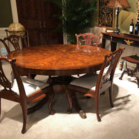 Dining table with chairs in living room.