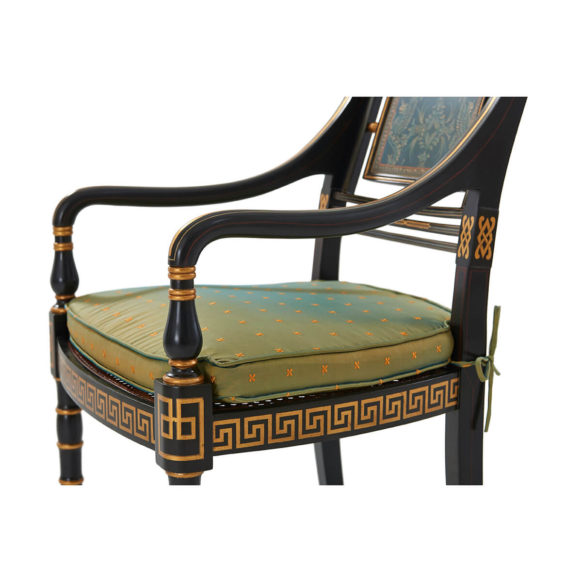 Close-up on armrest and cushion of gilt armchair.