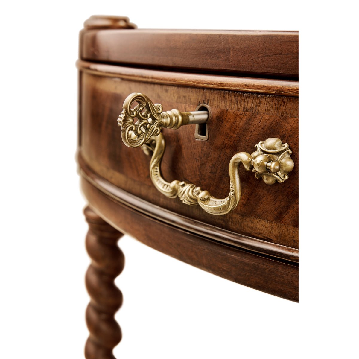 Close-up of ornate handle on round side table.