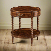 Elegant round side table on wooden floor.