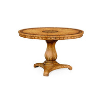 Angled view of satinwood tilt-top center table, intricate design.