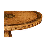Close-up of ornate edge on satinwood center table.