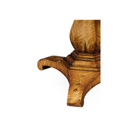 Detailed view of table base, curved wooden legs.