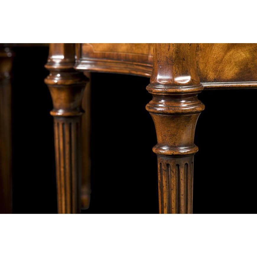Mahogany sideboard leg detail, fluted and carved design.