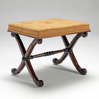 Regency stool with carved mahogany X frame, angled view.
