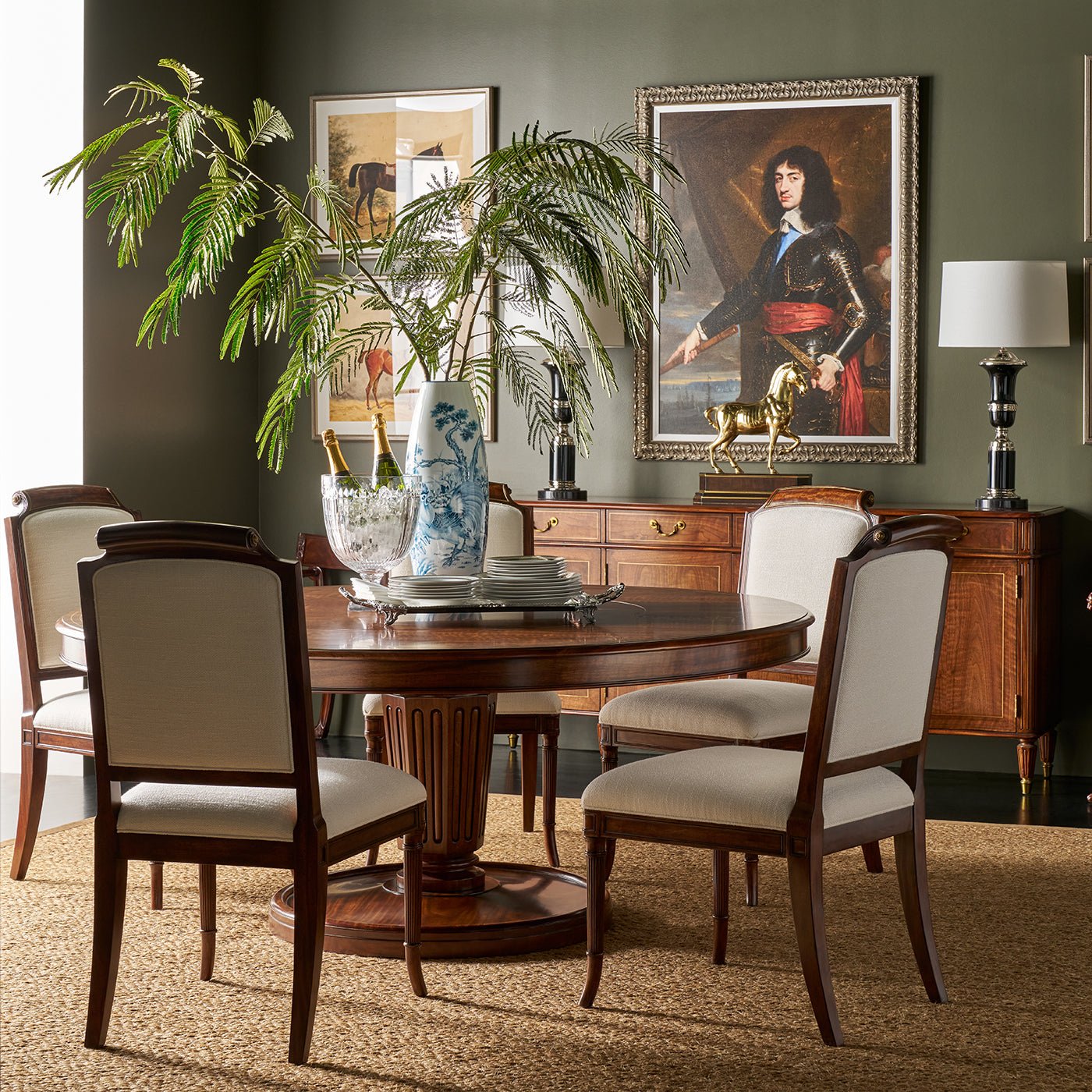 Dining room setup with elegant round dining table.
