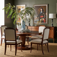 Dining room setup with elegant round dining table.