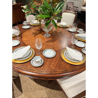 Elegant dining table with complete table setting.