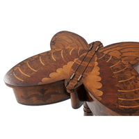 Close-up of butterfly table's wood inlay and hinges.