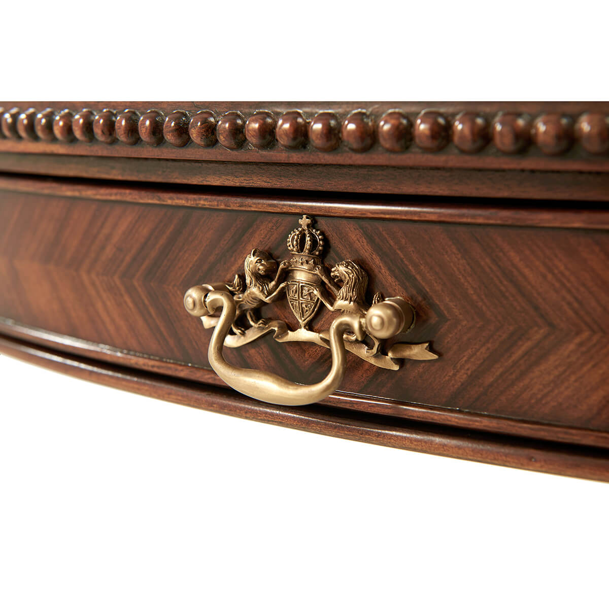 Detailed drawer with ornate handle, Regency style table.